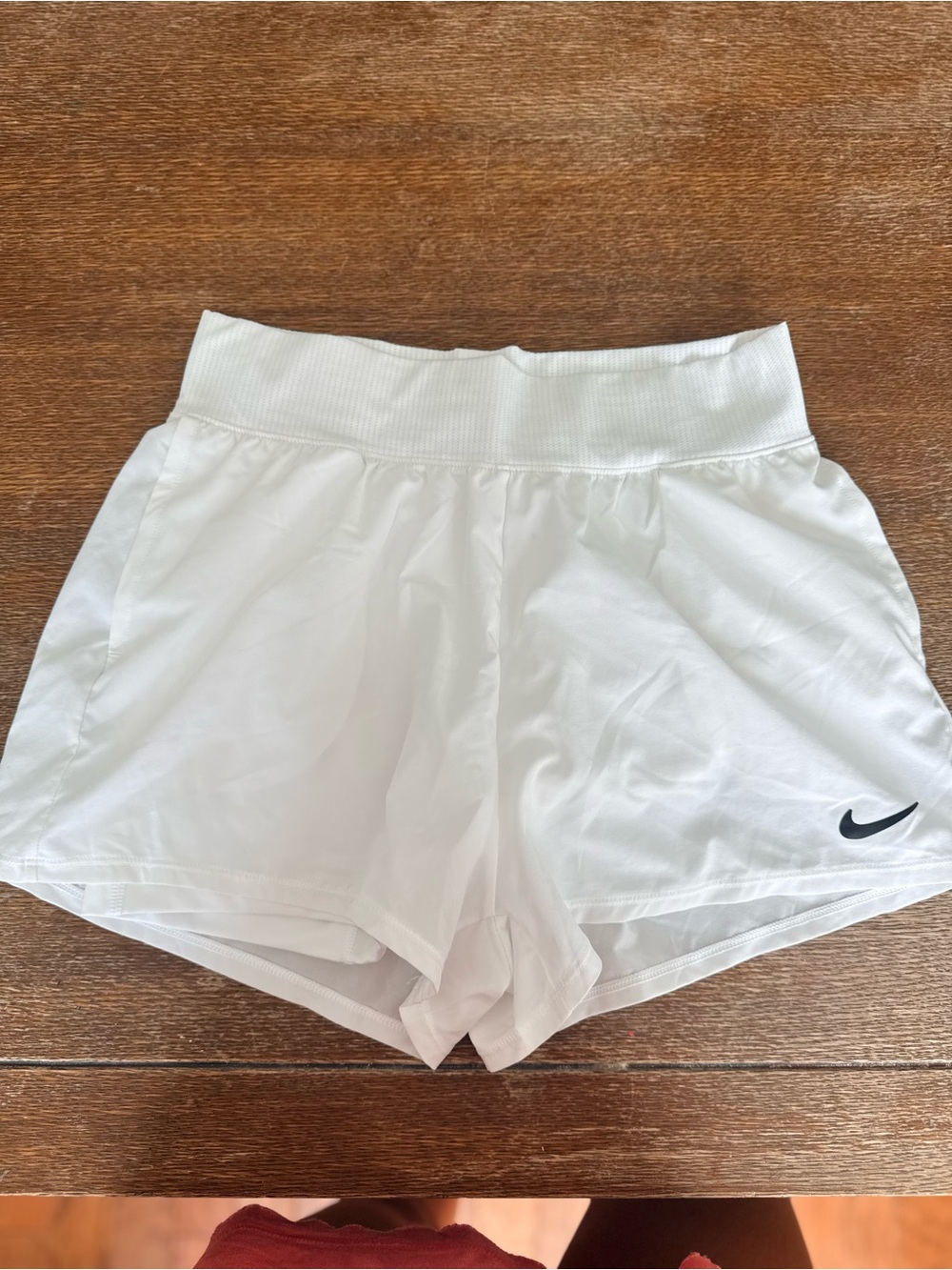 Nike Women's White Athletic Shorts with Black Swoosh